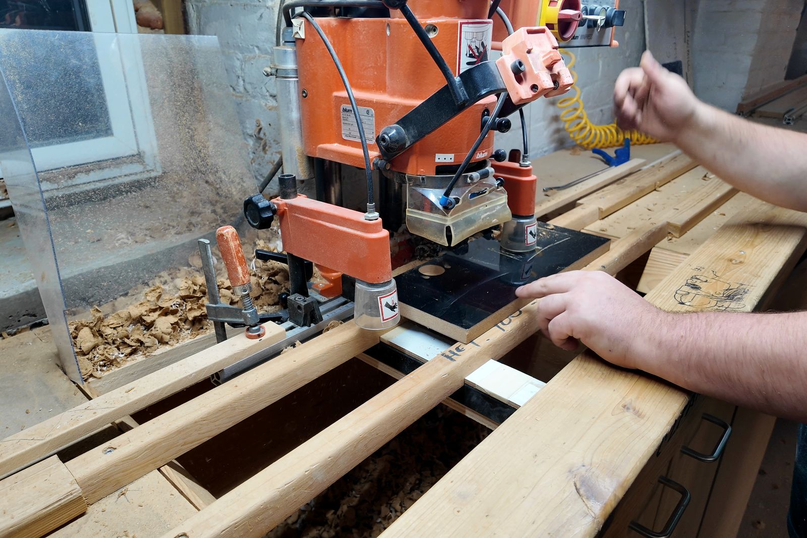 Edge banding a panel in our Winnipeg workshop