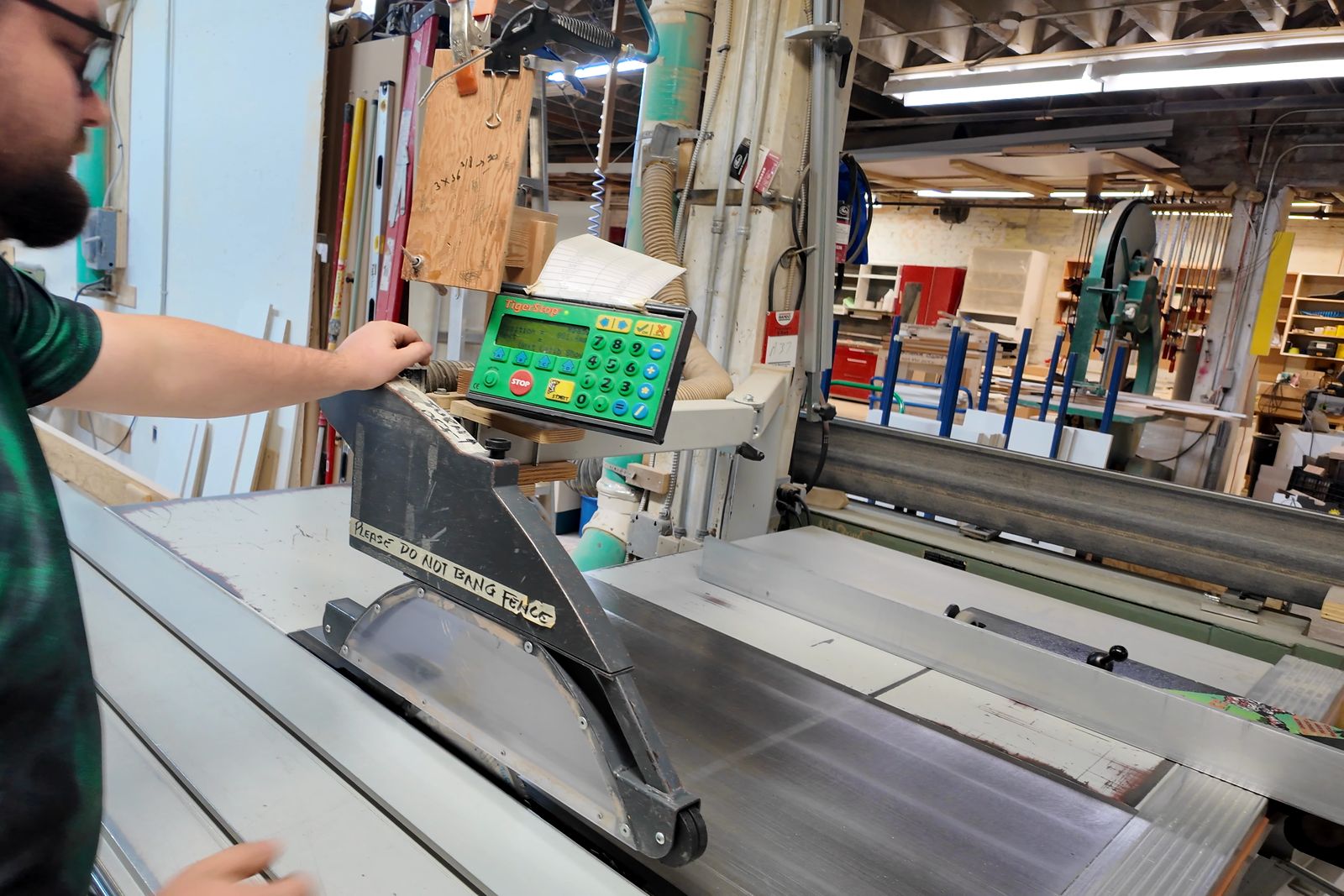 Cutting panels on the sliding table saw in our Winnipeg workshop